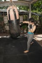 Beautiful Asian women are punching sandbags in the gym, exercise ideas, weight loss, muscle building and self defense. Royalty Free Stock Photo