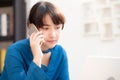 Beautiful asian young businesswoman excited and glad of success work with laptop, girl taking mobile smart phone Royalty Free Stock Photo