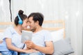 Beautiful asian young couple listening to music with tablet on bed, Love, dating Royalty Free Stock Photo