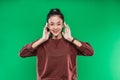 beautiful Asian young girl expressing with raised two hands isolated