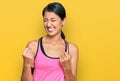 Beautiful asian young sport woman wearing sportswear and arm band very happy and excited doing winner gesture with arms raised, Royalty Free Stock Photo