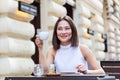 Beautiful Asian young woman with cup of coffee. Woman enjoys fresh coffee in the morning with sunrise at coffe shop Beautiful Royalty Free Stock Photo