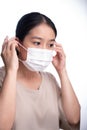 Beautiful asian young woman with disposable face mask