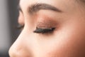 Beautiful asian young woman with eyelash extensions applying mascara Royalty Free Stock Photo