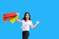 Beautiful asian young woman with shopping bags with smile while standing at the clothing store. Happiness, consumerism, sale and Royalty Free Stock Photo