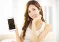 Beautiful young woman showing the smart phone Royalty Free Stock Photo
