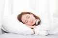 Beautiful asian young woman sleeping lying in bed on bedroom with head on pillow comfortable and happy Royalty Free Stock Photo