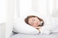 Beautiful asian young woman sleeping lying in bed on bedroom with head on pillow comfortable and happy Royalty Free Stock Photo