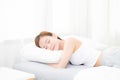 Beautiful asian young woman sleeping lying in bed with head on pillow comfortable and happy. Royalty Free Stock Photo