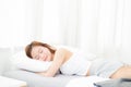 Beautiful asian young woman sleeping lying in bed with head on pillow comfortable and happy Royalty Free Stock Photo