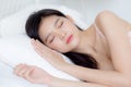 Beautiful asian young woman in underwear sleep lying on bed with comfort and happy leisure at bedroom. Royalty Free Stock Photo