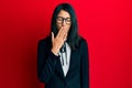 Beautiful asian young woman wearing business suit bored yawning tired covering mouth with hand Royalty Free Stock Photo