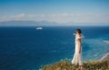 Beautiful Asian young woman in white dress outdoor