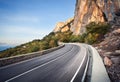 Beautiful asphalt road in autumn forest at sunrise. Mountains Royalty Free Stock Photo