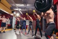 Beautiful athletes doing kettlebell swings. Royalty Free Stock Photo