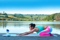 Beautiful athletic girl doing yoga against the backdrop of beautiful nature, pose asana Balasana. The concept of a healthy Royalty Free Stock Photo