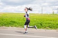 beautiful athletic girl runs at the city sports competition, Run