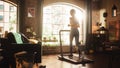 Beautiful Athletic Sports Woman Running on a Treadmill at Her Home Gym. Workout Female Athlete Royalty Free Stock Photo