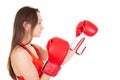 Beautiful athletic woman hitting in boxing red gloves with long hair Isolated in white background Royalty Free Stock Photo