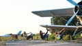 Beautiful, athletic, young women in sunglasses, in tights, perform synchronously different strength exercises, jumps Royalty Free Stock Photo