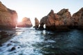 beautiful Atlantic ocean view horizon with sandy beach, rocks and waves at sunrise.