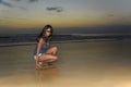 Attractive african american black woman walking on sunset beach Royalty Free Stock Photo