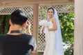 Beautiful Attractive Asian Bride Woman wearing white wedding dress and holding bouquet smile Royalty Free Stock Photo