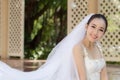 Beautiful Attractive Asian Bride Woman wearing white wedding dress and holding bouquet smile Royalty Free Stock Photo