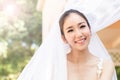 Beautiful Attractive Asian Bride Woman wearing white wedding dress and holding bouquet smile Royalty Free Stock Photo