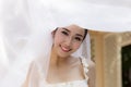 Beautiful Attractive Asian Bride Woman wearing white wedding dress and holding bouquet smile Royalty Free Stock Photo