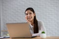 Beautiful Attractive Asian indian woman working with computer laptop and thinking to get ideas and requirement in Business startup Royalty Free Stock Photo