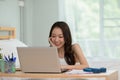 Beautiful Attractive Asian indian woman working with computer laptop and thinking to get ideas and requirement in Business startup Royalty Free Stock Photo