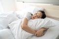 Beautiful Attractive Asian woman sleep and sweet dream lying on bed in cozy bedroom in the morning feeling so relax. Healthcare Royalty Free Stock Photo