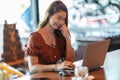 Beautiful Attractive Asian woman working with computer laptop and thinking to get ideas and requirement in Business startup Royalty Free Stock Photo