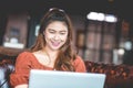 Beautiful Attractive Asian woman working with computer laptop and thinking to get ideas and requirement in Business startup Royalty Free Stock Photo