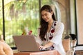 Beautiful Attractive Asian woman working with computer laptop