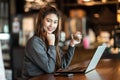 Beautiful Attractive Business Asian woman working with laptop and looking in monitor smile and have positive emotional