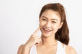 Beautiful Attractive Charming Asian young woman smile with white teeth and touching soft cheek
