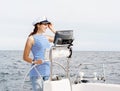 Beautiful, attractive young girl pilots a boat Mediterranean Sea