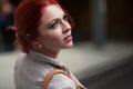 Beautiful, attractive young woman with red hair relaxing in town, shopping Royalty Free Stock Photo