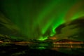 Beautiful aurora borealis, polar lights, over mountains in the North of Europe - Lofoten islands, Norway Royalty Free Stock Photo