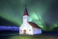 A beautiful aurora dancing over the church at the village of Vik.