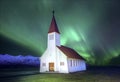 A beautiful aurora dancing over the church at the village of Vik in southern Iceland