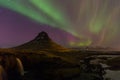 Beautiful aurora over Kirkjufell mountain in Iceland