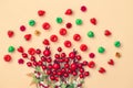 Beautiful autumn background, artificial miniature apples and red berries