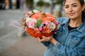 beautiful autumn bouquet in pumpkin in the hands of woman. Decoration for Thanksgiving day. Royalty Free Stock Photo