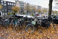 Beautiful Autumn Canal Scene with Colorful Fallen Leaves and Bikes in the Grachtengordel Neighborhood of Amsterdam Royalty Free Stock Photo