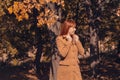 Beautiful autumn - cheerful ginger girl in nature