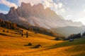 Beautiful autumn colors at the foot of the Odle Mountains in the backdrop of the Seceda Mountains in the Dolomites, Trentino Alto Royalty Free Stock Photo