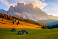 Beautiful autumn colors at the foot of the Odle Mountains in the backdrop of the Seceda Mountains at sunset in the Dolomites, Royalty Free Stock Photo